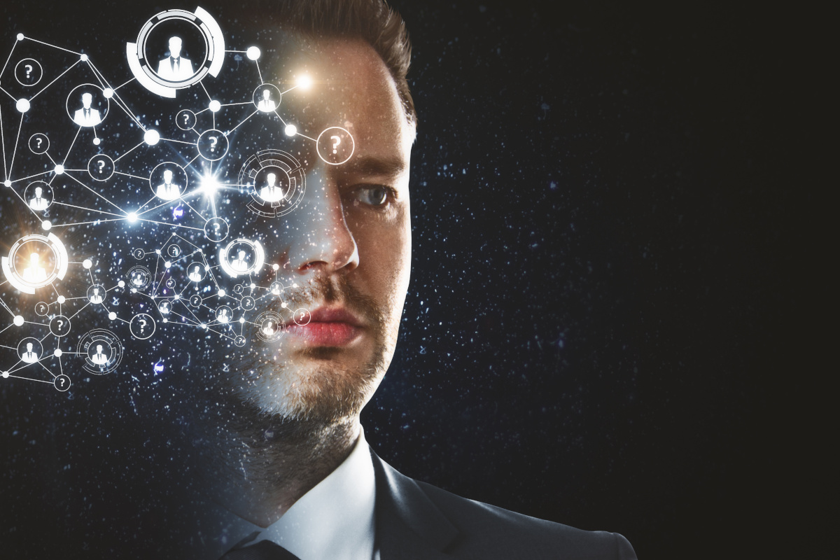 A businessman on a dark background with various social icons on half of his face