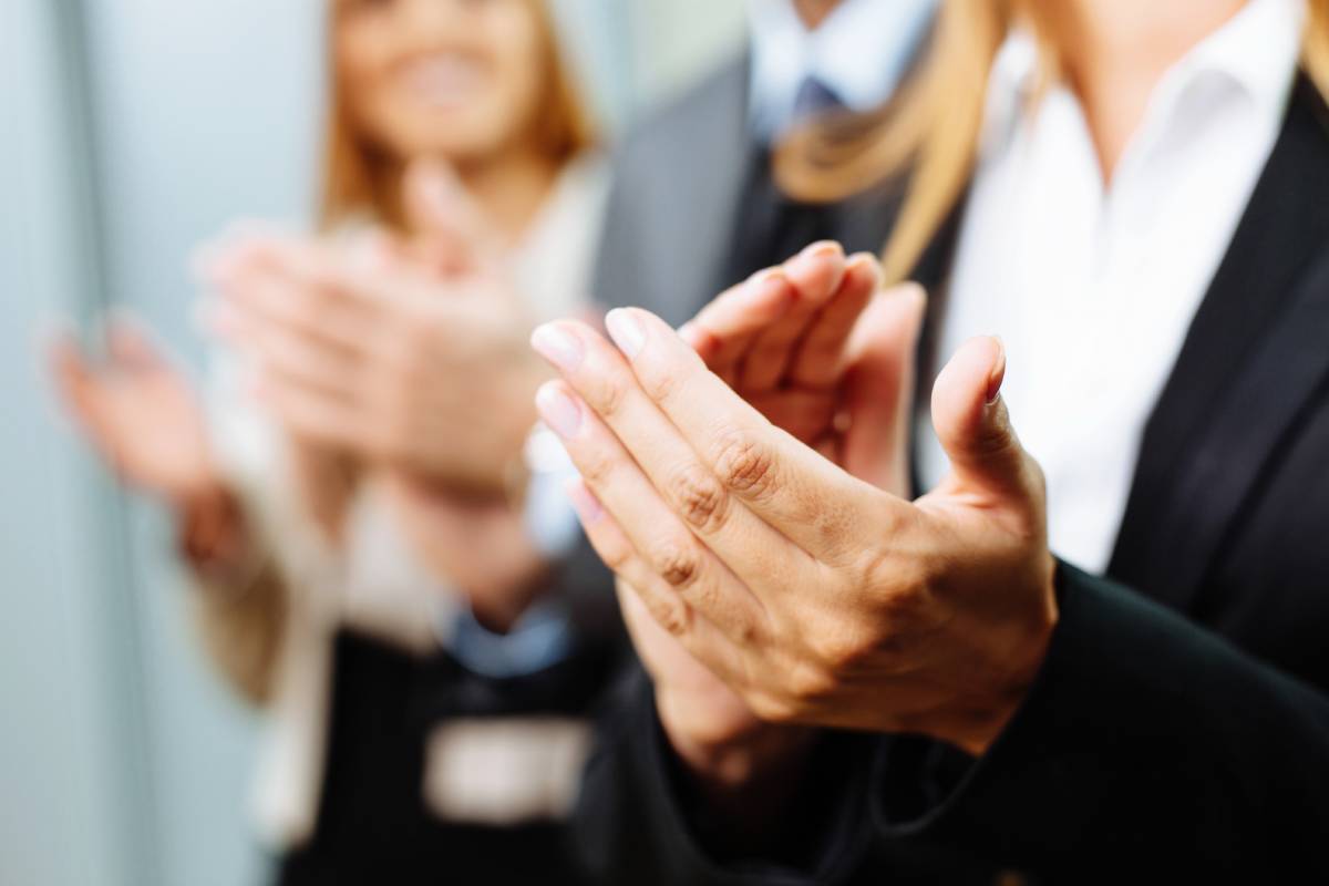 Business people clapping because of the great news